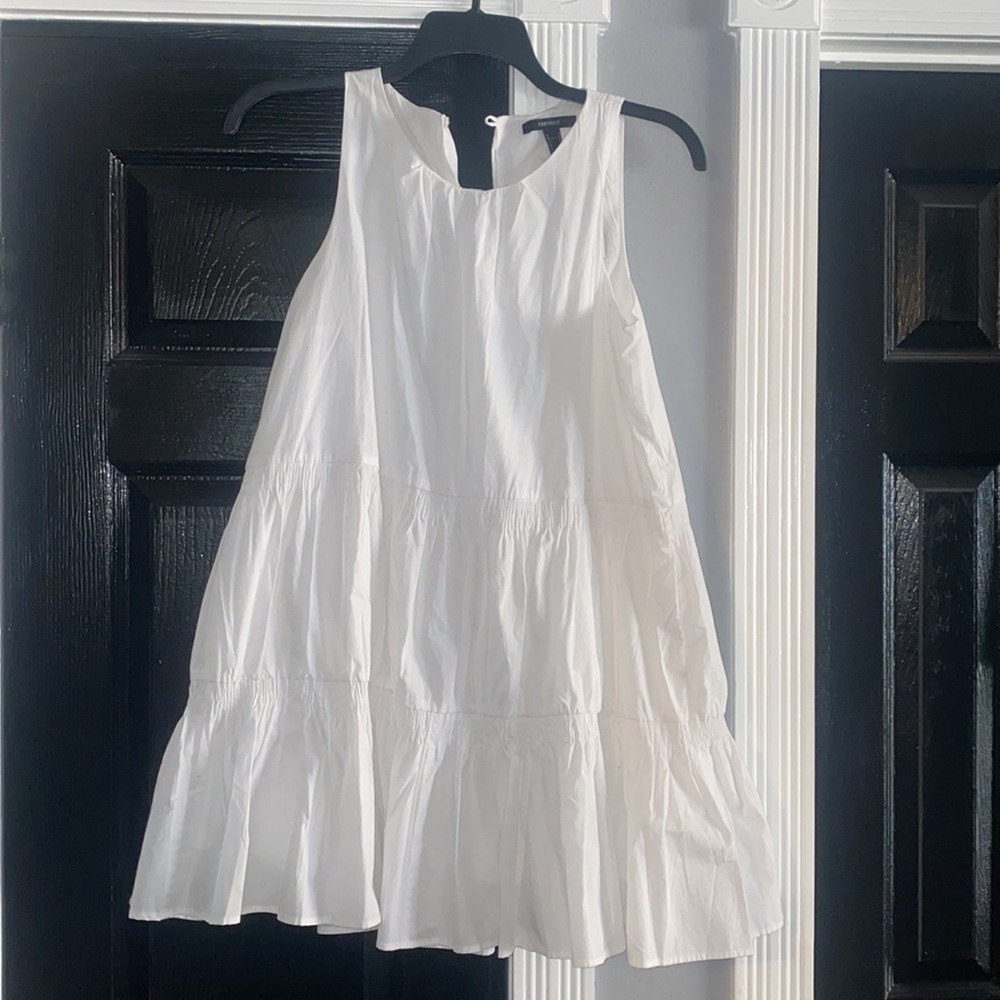 Crisp white lined flattering A line mini dress